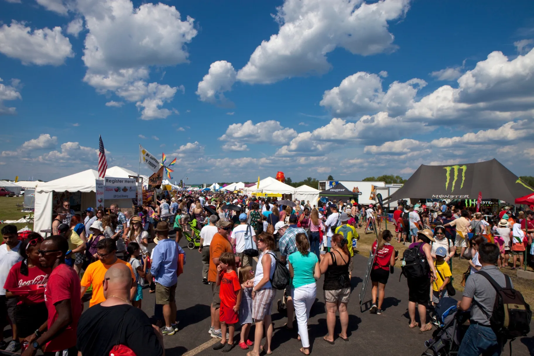 Crowds of people and exibitor tents at the New Jersey Ballooning Festival in Whitehouse Station
